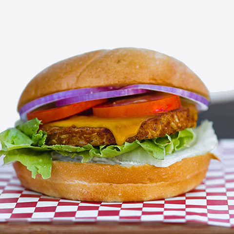 Burger with Garden Patty, American Cheese, Mayonnaise, Lettuce, Tomato, Red Onion on a Fresh Kaiser Roll